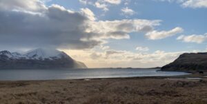 Winter beach in Adak Alaska with partial cloud cover