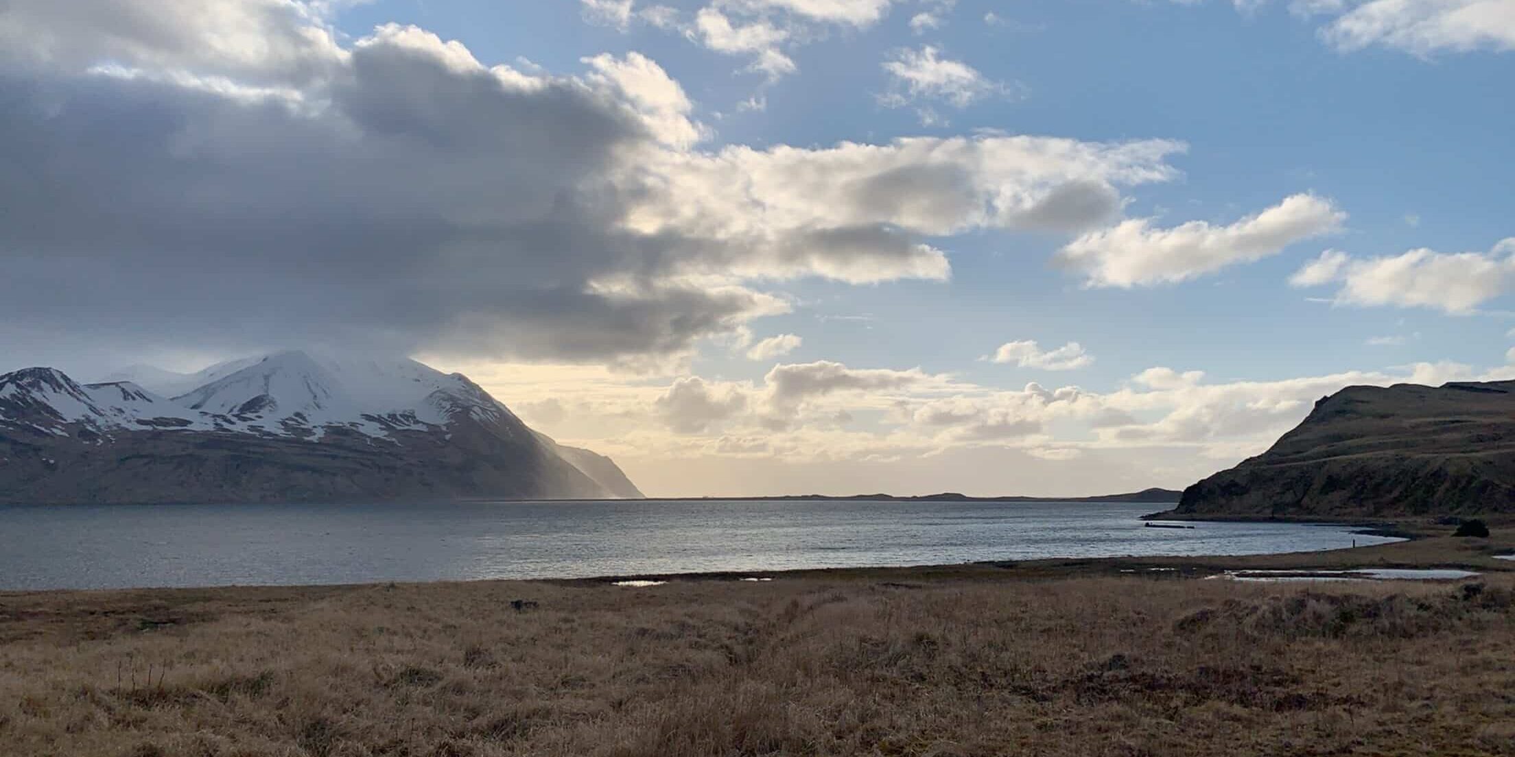 Winter beach in Adak Alaska with partial cloud cover