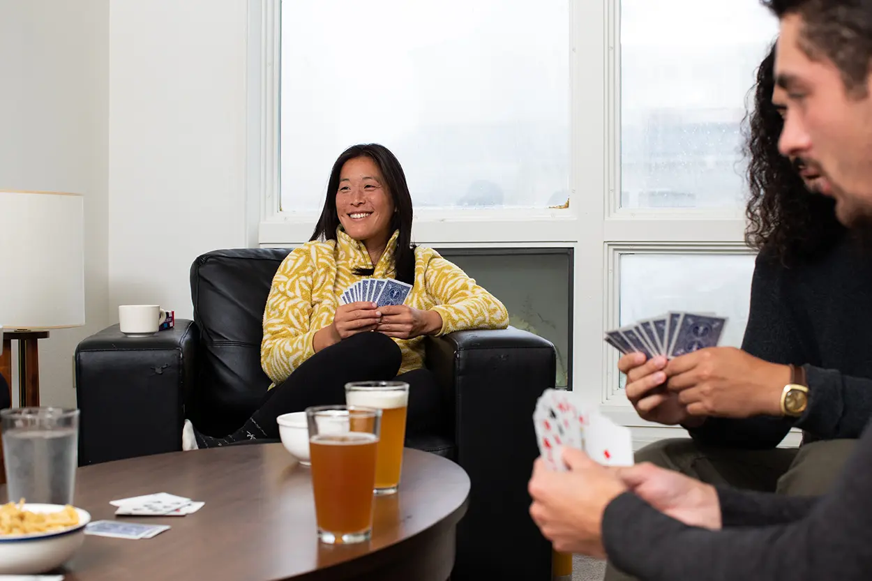 Group playing cards at Adak Island Inn.